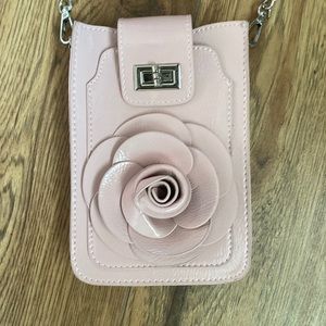 A statement piece flower Bag with see through phone holder and multiple pockets